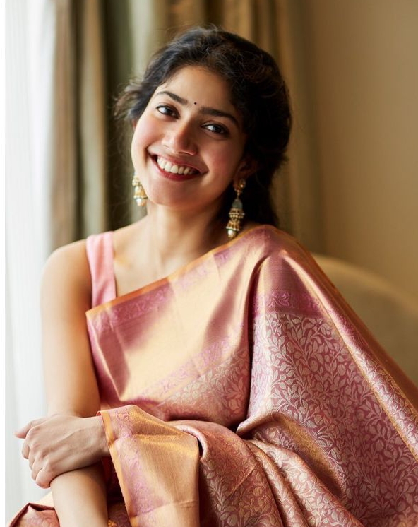 Sai Pallavi was born on May 9, 1992, in Kotagiri, Tamil Nadu, India. She was raised in a Tamil-speaking family with roots in Tamil Nadu. Sai's father, Senthamarai Kannan, is an Assistant Superintendent of Police, and her mother, Radha Kannan, is a homemaker. Growing up in a disciplined and culturally rich environment, Sai developed a passion for dance and acting from a young age, inspired by the vibrant artistic heritage of South India.